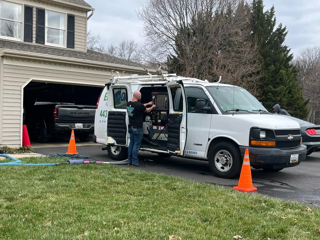 Eco-Dry technician with truck-mounted equipment at a customer home